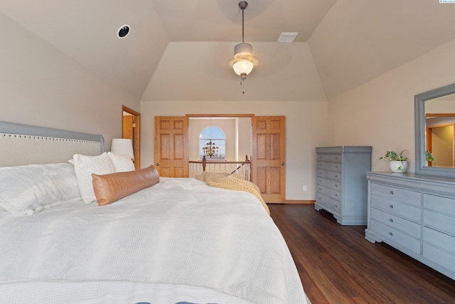 bedroom with lofted ceiling, dark wood-type flooring, and ceiling fan