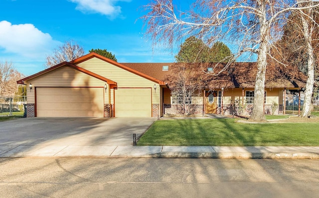 view of front of property with a garage and a front yard