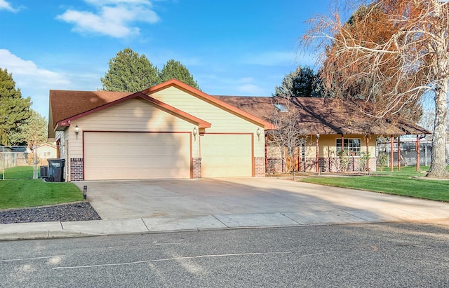 view of front of property featuring a garage and a front yard