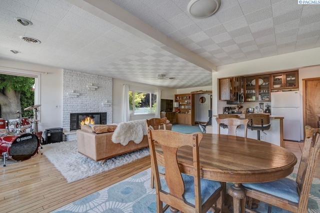 1706 Gaillard Pl, Richland, WA 99354 - dining area featuring light wood-style flooring and a brick fireplace