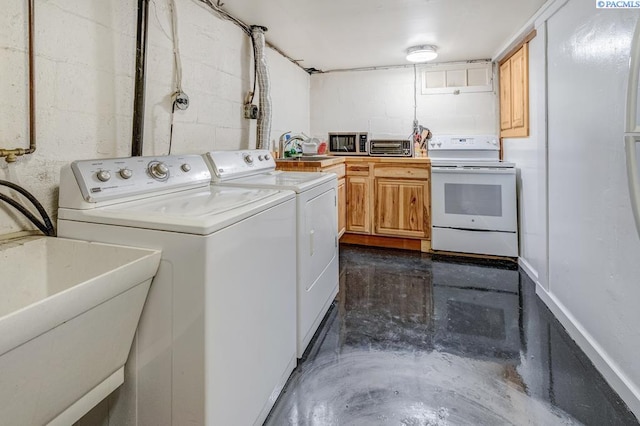 1706 Gaillard Pl, Richland, WA 99354 - laundry area with a sink, washer and clothes dryer, and concrete block wall