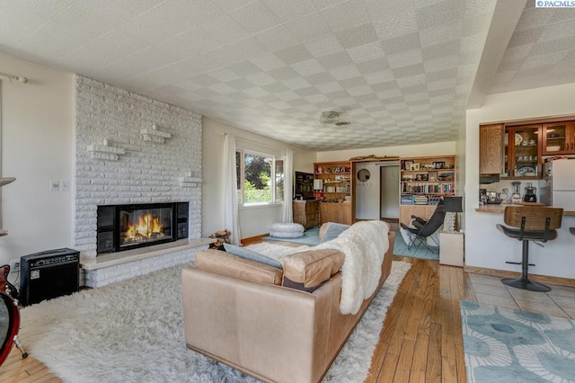 1706 Gaillard Pl, Richland, WA 99354 - living room featuring wood-type flooring and a fireplace