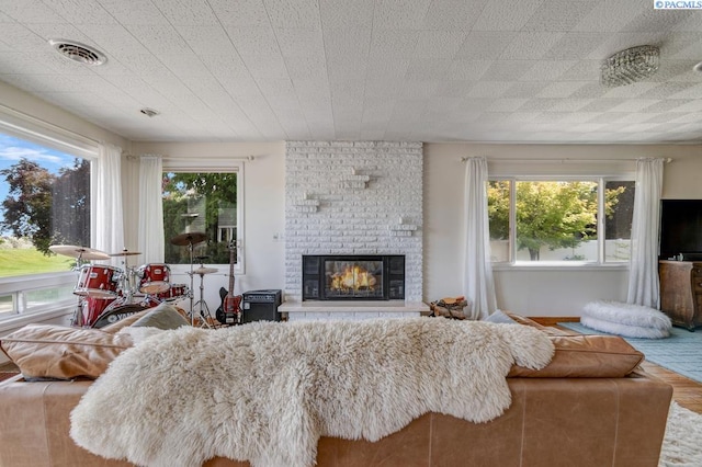 1706 Gaillard Pl, Richland, WA 99354 - living room with plenty of natural light and a brick fireplace