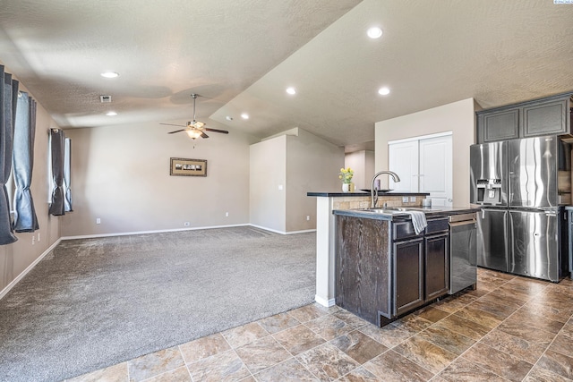 3313 Aqueduct Ln, Pasco, WA 99301 - kitchen featuring stainless steel appliances, dark carpet, baseboards, a sink, and dark countertops