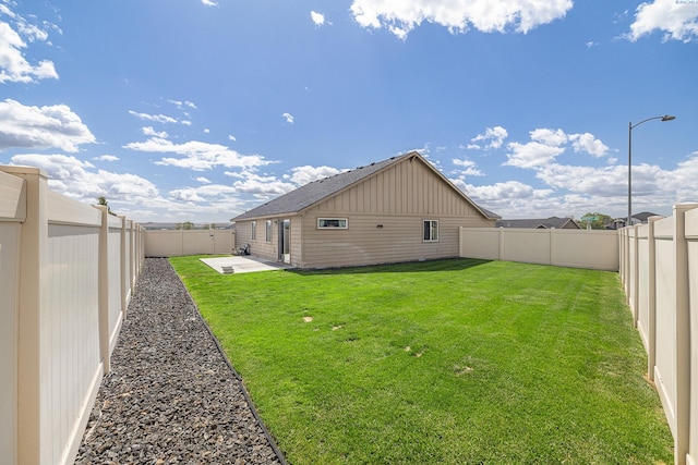 3313 Aqueduct Ln, Pasco, WA 99301 - rear view of house with board and batten siding and a patio area