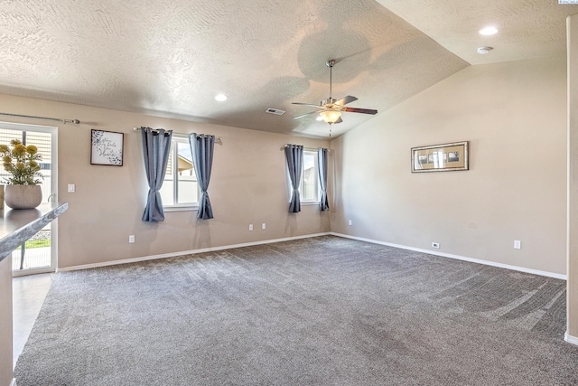3313 Aqueduct Ln, Pasco, WA 99301 - carpeted empty room featuring a textured ceiling, healthy amount of natural light, baseboards, and lofted ceiling
