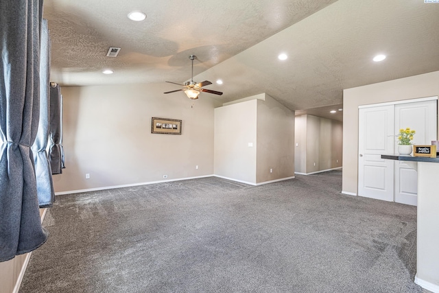 3313 Aqueduct Ln, Pasco, WA 99301 - unfurnished living room with baseboards, a ceiling fan, carpet, vaulted ceiling, and recessed lighting