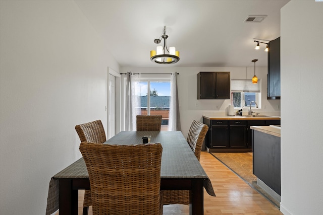 4763 Poppy St, West Richland, WA 99353 - dining space featuring sink and light wood-type flooring