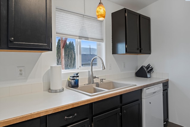 4763 Poppy St, West Richland, WA 99353 - kitchen featuring dishwasher, sink, and decorative light fixtures