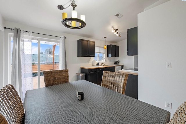 4763 Poppy St, West Richland, WA 99353 - dining space with rail lighting and sink