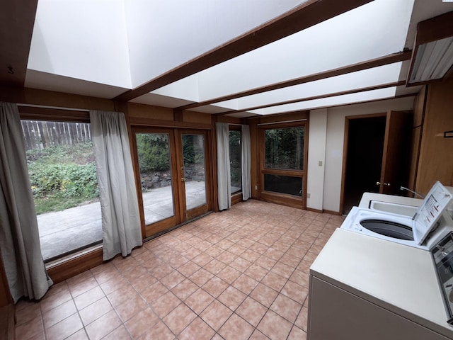 1630 NE Gaines Rd, Pullman, WA 99163 - laundry room with french doors, light tile patterned floors, and washer and dryer