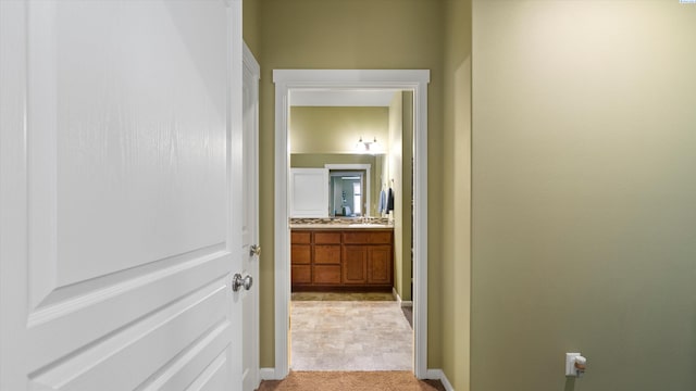 6102 Westmoreland Ln, Pasco, WA 99301 - corridor featuring light colored carpet and baseboards