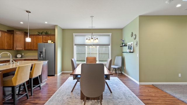 6102 Westmoreland Ln, Pasco, WA 99301 - dining area featuring a chandelier, dark wood-style floors, and recessed lighting