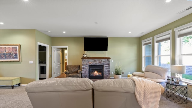 6102 Westmoreland Ln, Pasco, WA 99301 - living area featuring carpet floors, healthy amount of natural light, a stone fireplace, and recessed lighting