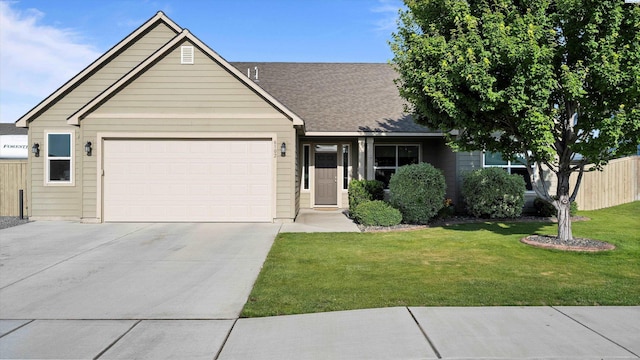 6102 Westmoreland Ln, Pasco, WA 99301 - view of front of home with driveway, an attached garage, and a shingled roof