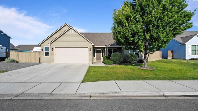 6102 Westmoreland Ln, Pasco, WA 99301 - view of front of house featuring an attached garage and driveway