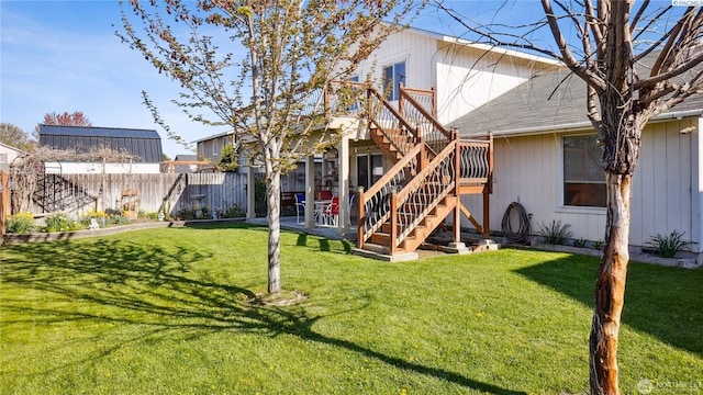 235 E Lilac Pl, Othello, WA 99344 - rear view of property featuring stairway, roof with shingles, and a wooden deck
