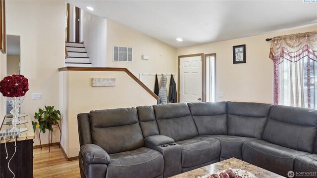 235 E Lilac Pl, Othello, WA 99344 - living room featuring light wood-style floors, vaulted ceiling, stairway, recessed lighting, and baseboards