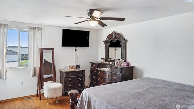 235 E Lilac Pl, Othello, WA 99344 - bedroom with wood finished floors, baseboards, and a ceiling fan