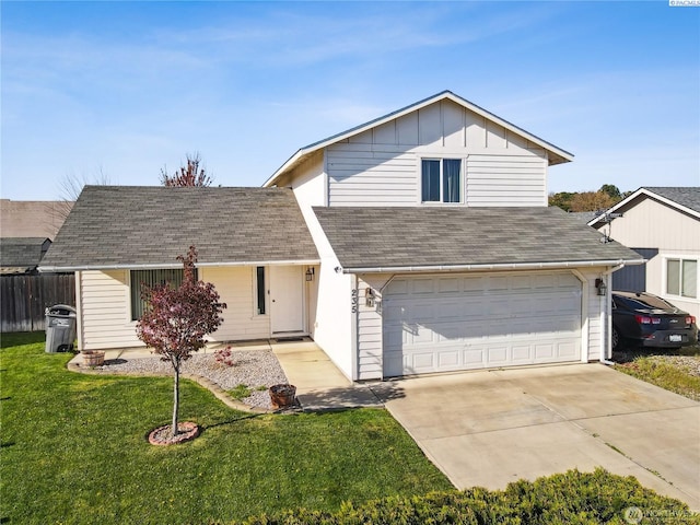 235 E Lilac Pl, Othello, WA 99344 - view of front of property with a garage, concrete driveway, roof with shingles, and board and batten siding