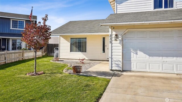 235 E Lilac Pl, Othello, WA 99344 - doorway to property with roof with shingles
