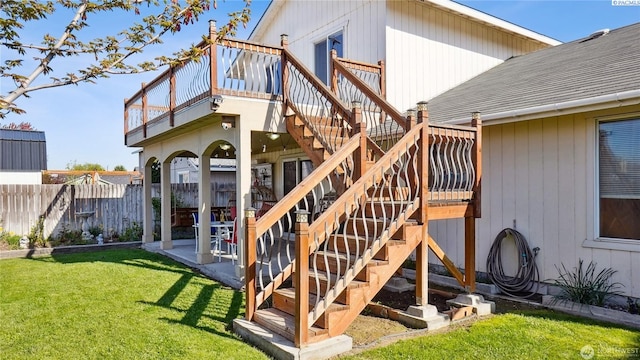 235 E Lilac Pl, Othello, WA 99344 - back of house with stairway, roof with shingles, a patio, and a deck
