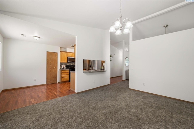 4607 Yuma Dr, Pasco, WA 99301 - unfurnished living room featuring dark carpet, a chandelier, baseboards, and dark wood-style flooring