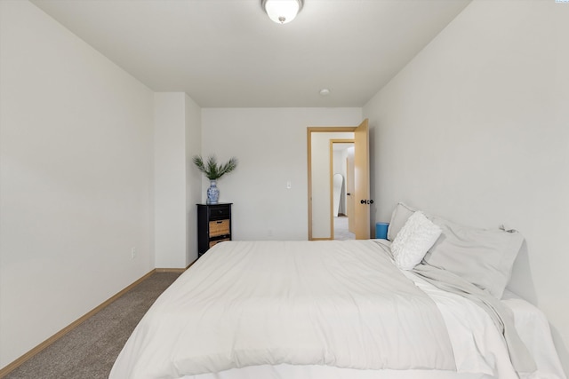 bedroom featuring carpet and baseboards