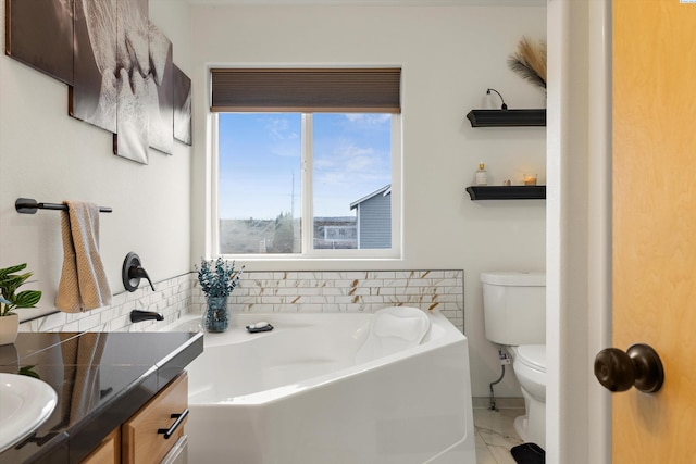 full bath featuring toilet, a washtub, and a sink