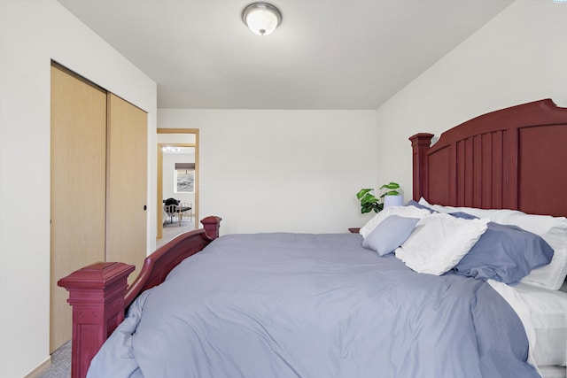 carpeted bedroom with a closet