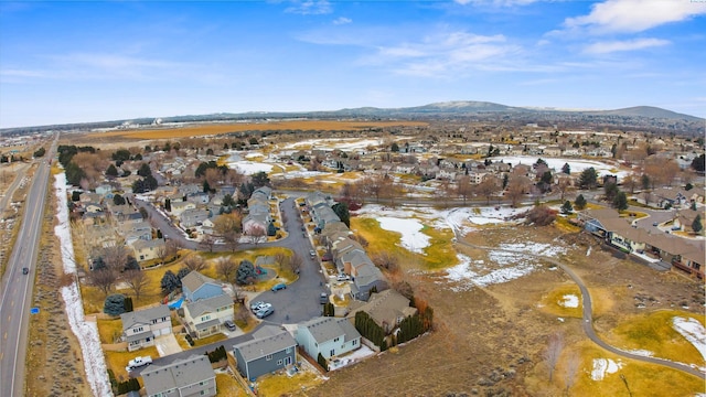 drone / aerial view featuring a residential view and a mountain view