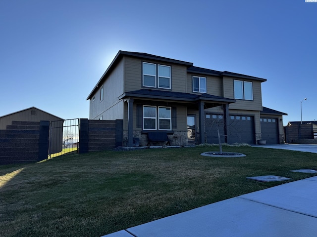 view of front of property featuring a garage and a front lawn