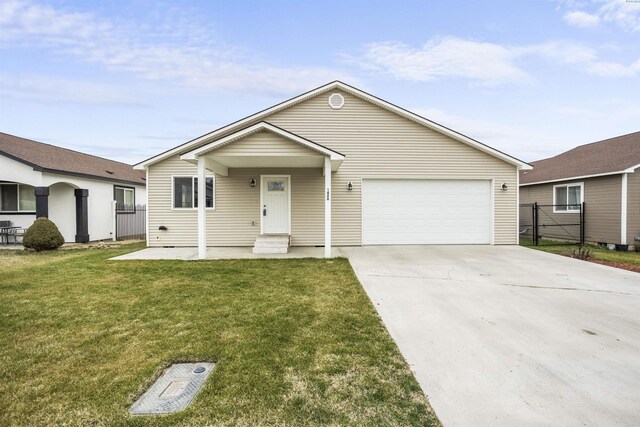1408 Singh Ln, Sunnyside, WA 98944 - single story home featuring a garage and a front lawn