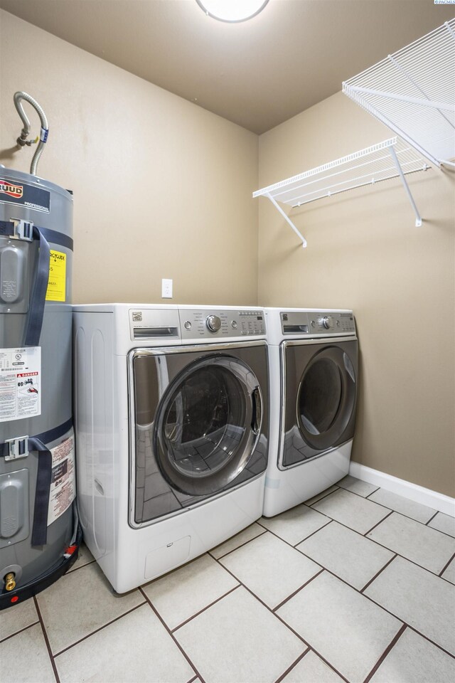 1408 Singh Ln, Sunnyside, WA 98944 - clothes washing area with separate washer and dryer, light tile patterned floors, and electric water heater