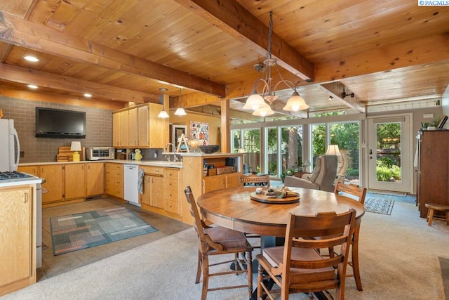 835 SE Spring St, Pullman, WA 99163 - dining area featuring plenty of natural light, a wooden ceiling with exposed beams, light colored carpet, and a chandelier