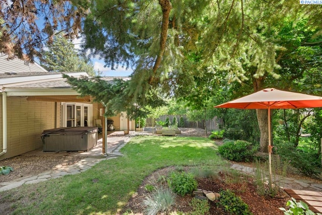 835 SE Spring St, Pullman, WA 99163 - fenced backyard with a hot tub and a patio area