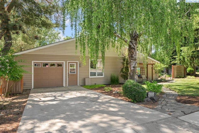 835 SE Spring St, Pullman, WA 99163 - view of front of property featuring concrete driveway and a garage
