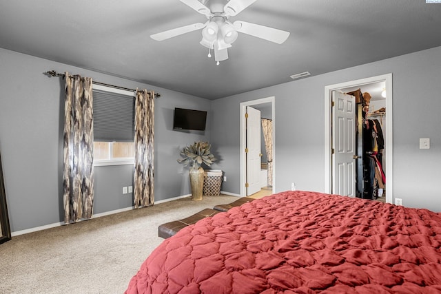 5504 Koufax Ln, Pasco, WA 99301 - bedroom with a walk in closet, carpet floors, baseboards, ensuite bathroom, and ceiling fan