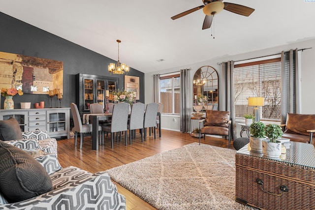 5504 Koufax Ln, Pasco, WA 99301 - living room with lofted ceiling, a chandelier, wood finished floors, ceiling fan, and beverage cooler