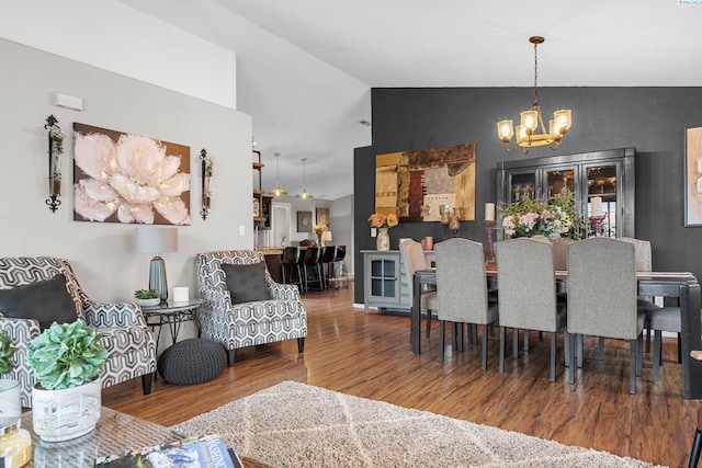 5504 Koufax Ln, Pasco, WA 99301 - dining room with a chandelier, wood finished floors, and lofted ceiling