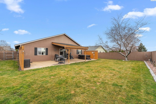 5504 Koufax Ln, Pasco, WA 99301 - back of property featuring a hot tub, a patio area, and central air condition unit