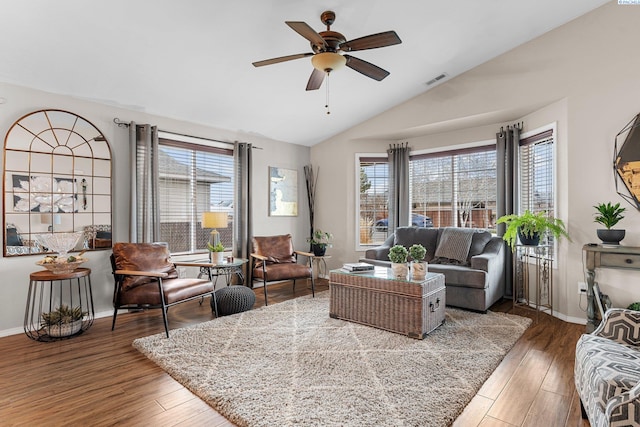 5504 Koufax Ln, Pasco, WA 99301 - living room with healthy amount of natural light, vaulted ceiling, a ceiling fan, wood finished floors, and baseboards