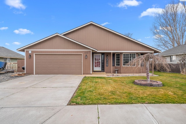 5504 Koufax Ln, Pasco, WA 99301 - ranch-style home with an attached garage and driveway