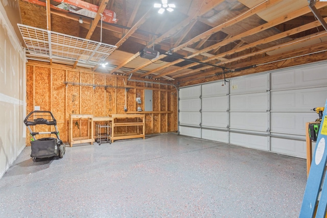 garage featuring electric panel and a garage door opener