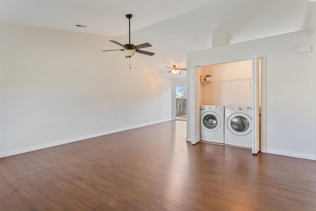 clothes washing area with laundry area, separate washer and dryer, visible vents, baseboards, and dark wood finished floors