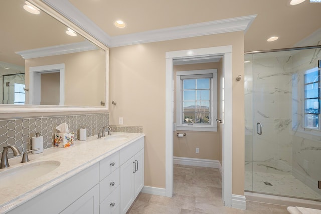 bathroom with ornamental molding, a marble finish shower, backsplash, and a sink