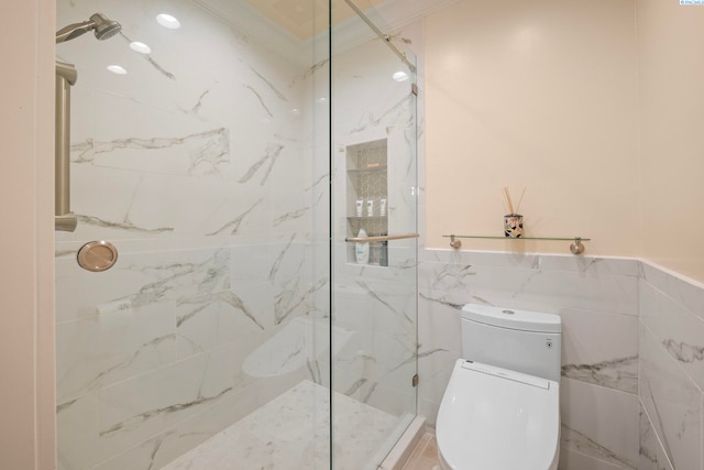 bathroom featuring a marble finish shower, toilet, and tile walls