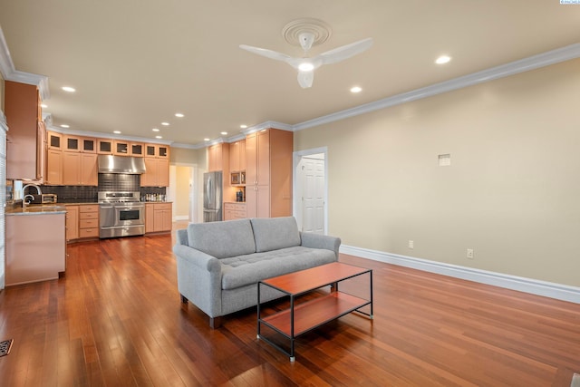 living area with dark wood finished floors, recessed lighting, baseboards, and ornamental molding