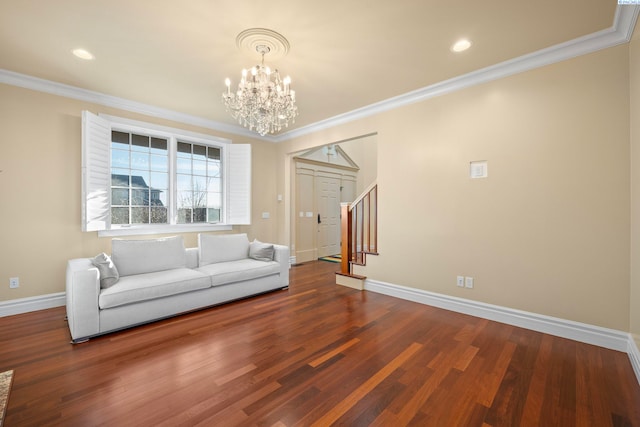 unfurnished living room with stairway, crown molding, baseboards, and wood finished floors