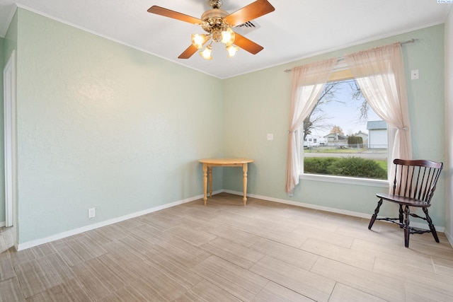 sitting room with crown molding, ceiling fan, and light hardwood / wood-style flooring